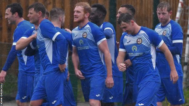 Skelmersdale United players celebrate scoring a goal
