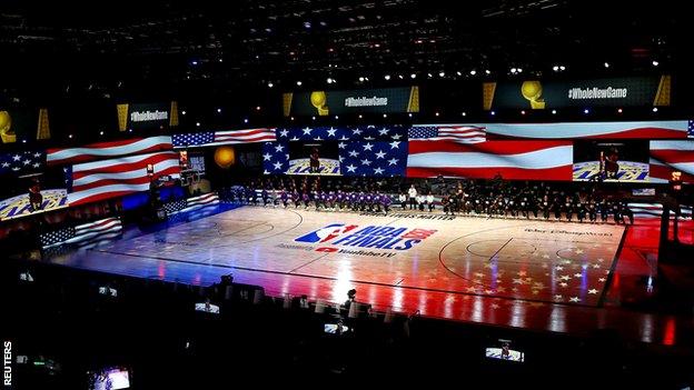 General shot of the Los Angeles Lakers and the Miami Heat taking the knee before the start of the game