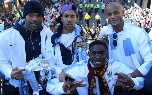 Micah Richards on City's 2011-12 title parade with (l-r) Joleon Lescott, Gael Clichy and Vincent Kompany
