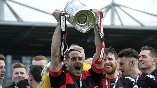 Sean Ward holds the Gibson Cup aloft after Crusaders won the Premiership two years ago