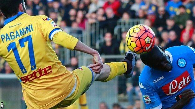 Napoli defender Kalidou Koulibaly heads the ball away from Frosinone forward Luca Paganini's boot.