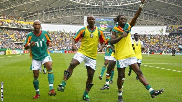 El Hadji Diouf, Amara Traore and Ferdinand Coly celebrate after beating Sweden in the Round of 16 at the 2002 World Cup