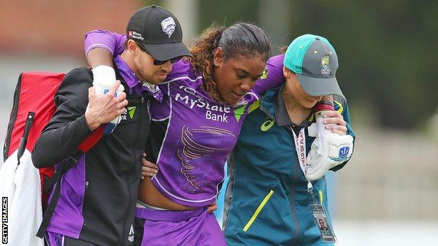 Hayley Matthews is helped off the pitch during a Women's Big Bash League game