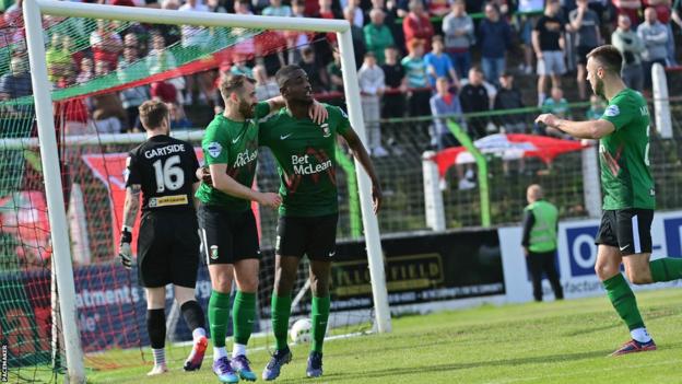 Junior celebrates scoring the opener for Glentoran in Saturday's win over Cliftonville