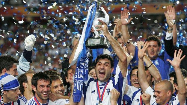 Greece's Traianos Dellas lifts the Euro 2004 trophy