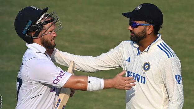 England's Ben Duckett (left) is congratulated by India captain Rohit Sharma (right) as they leave the field