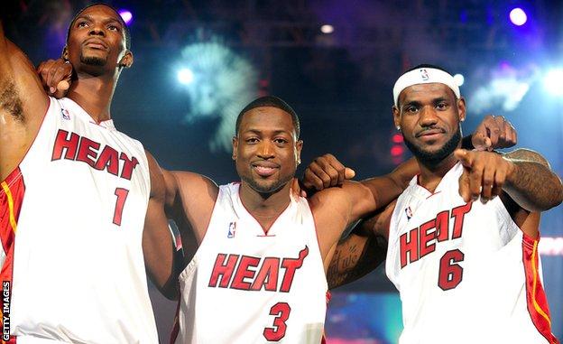 MIAMI - JULY 09: Fans cheer as (L-R) Dwyane Wade #3, Chris Bosh #1 and LeBron James #6 of the Miami Heat are introduced during a welcome party at American Airlines Arena on July 9, 2010 in Miami, Florida. (Photo by Marc Serota/Getty Images)