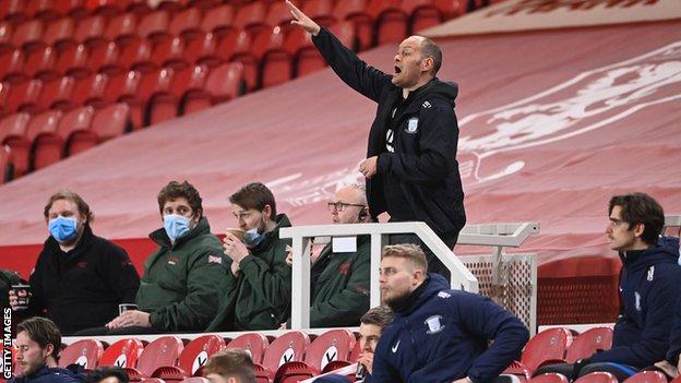 Preston manager Alex Neil shouts from the stands after his sending off