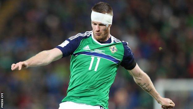 Chris Brunt sports a bandage after sustaining a head injury in the 4-0 win over Azerbaijan in November 2016