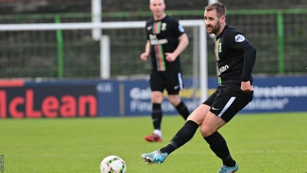 Northern Ireland winger Niall McGinn made his debut for Glentoran
