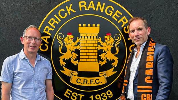 Carrick Rangers chairman Peter Clarke pictured with the club's majority shareholder Michael Smith