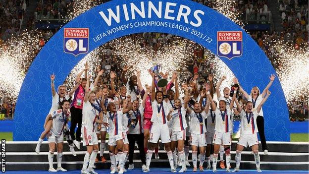 Lyon celebrate with the Champions League trophy