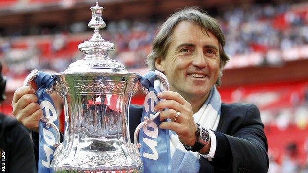 Manchester City manager Roberto Mancini with the FA Cup in 2011