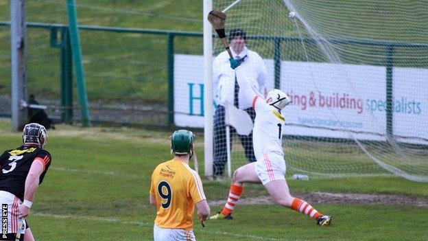 Antrim midfielder Paul Shiels watches his shot hit the top corner for the opening goal at Owenbeg