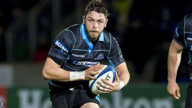 Roger Wilson runs with the ball for Glasgow