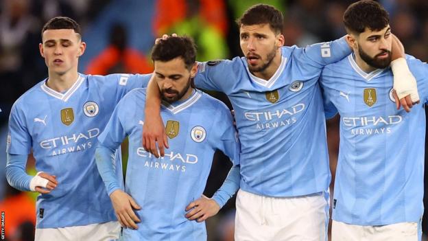Bernardo Silva, second from left, after missing his penalty, with his Manchester City team-mates