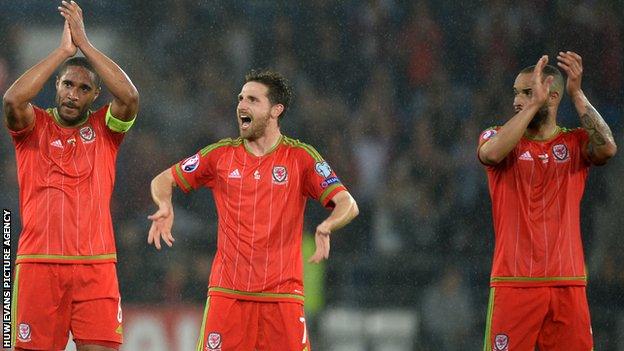 Ashley Williams, Joe Allen and Jazz Richards celebrate Wales' win over Belgium