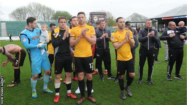 Newport County players applauding fans