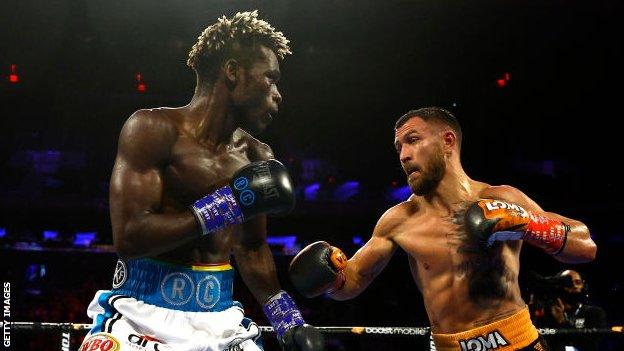 Ghanaian boxer Richard Commey (left) takes on Ukraine's Vasiliy Lomachenko