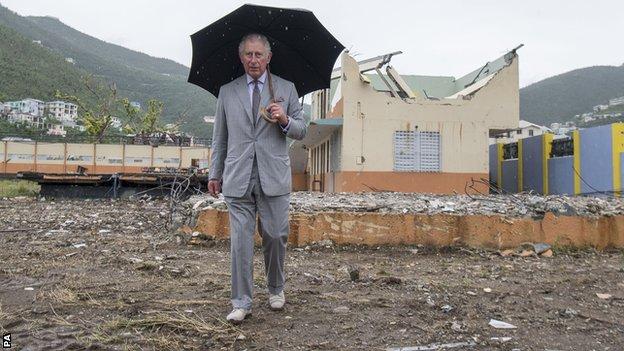The Prince of Wales visits the remains of Elmore Stoutt High School in Road Town during a visit to the island of Tortola