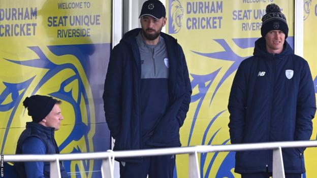 Hampshire and Durham players stand on balcony