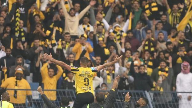 Morocco's Abderrazak Hamdallah celebrates with Al-Ittihad fans after scoring for them in January 2023