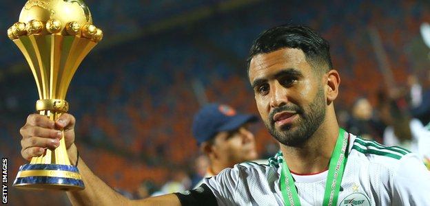 Algerian striker Riyad Mahrez with the African Cup of Nations trophy