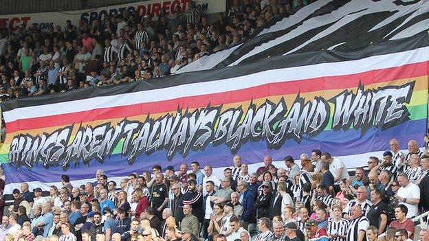A Newcastle United rainbow banner displaying the message: Things aren't always black and white
