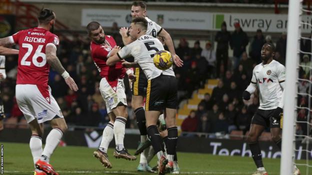Elliot Lee scores the second for Wrexham against Newport in League Two in December 2023