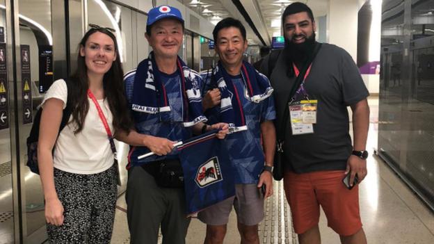 Japan fan Take, his friend and BBC Sport reporters Emma and Shamoon
