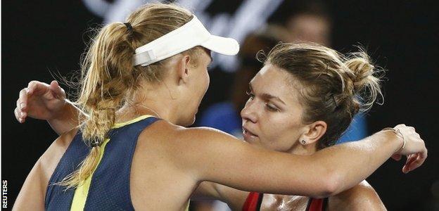 Wozniacki and Halep embrace at the end of the match