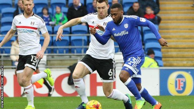 Cardiff City's Junior Hoilett is tackled by Kevin McDonald