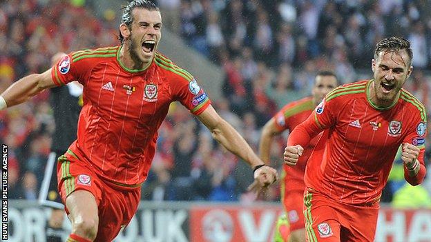 Gareth Bale and Aaron Ramsey celebrate Wales' goal against Belgium in Cardiff