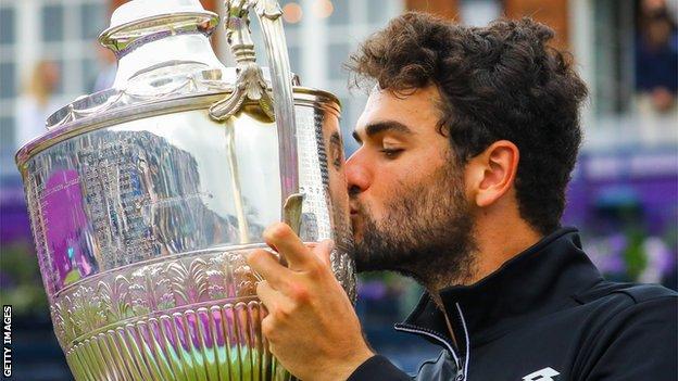 Matteo Berrettini kisses Queen's trophy