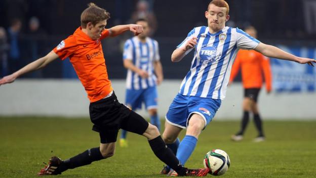 Glenavon defender Rhys Marshall and Coleraine's Rodney Brown battle for the ball at the Showgrounds