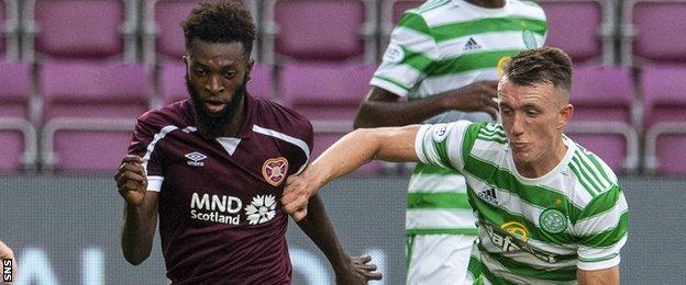 Hearts' Beni Baningime takes on Celtic's David Turnbull