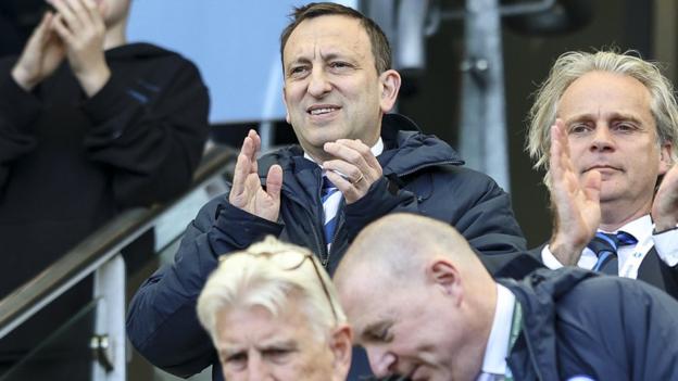 Brighton owner Tony Bloom (centre)