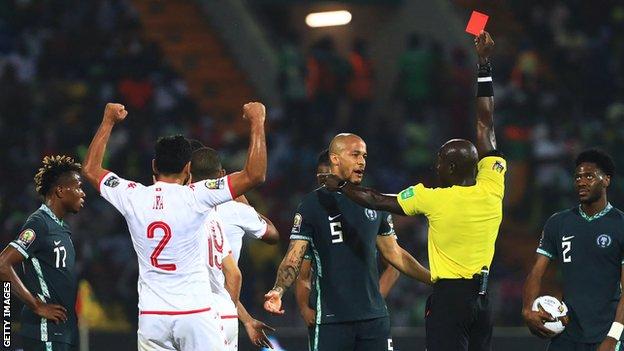 Nigeria midfielder Alex Iwobi is sent off against Tunisia