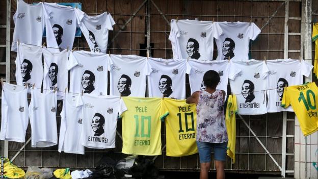 Shirts with Pele's face and number 10 are hung up in the Santos FC stadium