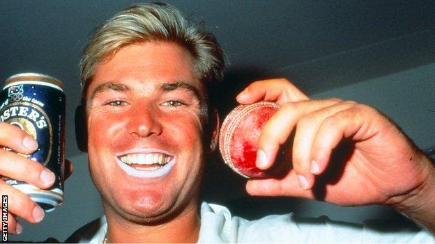 Classic Warnie: Shane sports his signature lip zinc and celebrates with a beer after a match in the 1990s