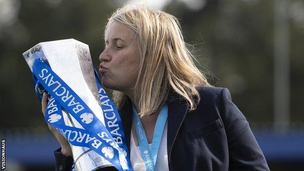 Emma Hayes kisses the FAWSL trophy