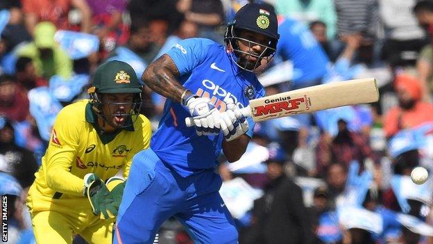 Australia wicketkeeper Alex Carey and India batsman Shikhar Dhawan
