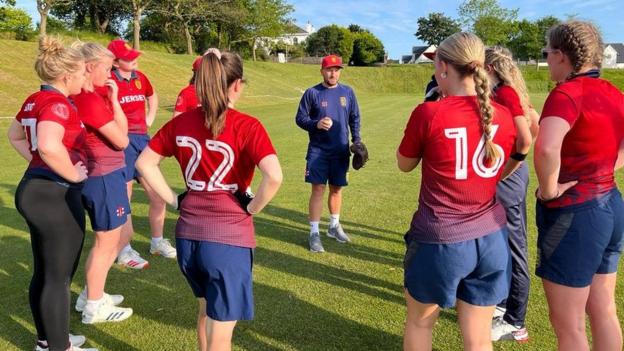 Jersey coach Lee Meloy talks to his players