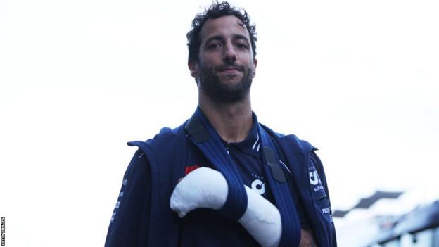 Daniel Ricciardo with his broken left hand in a sling