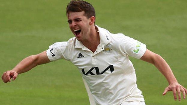 Tom Lawes celebrates taking one of his four wickets