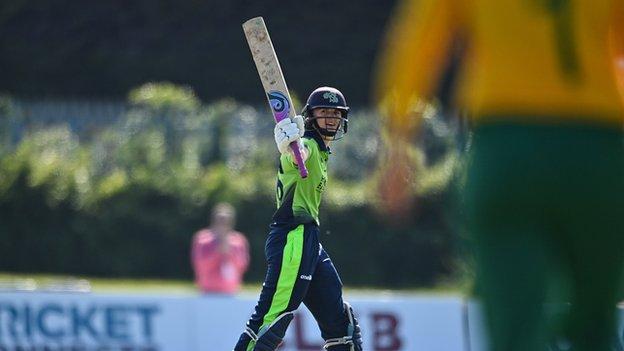 Ireland captain Gaby Lewis celebrates bringing up her half century against South Africa