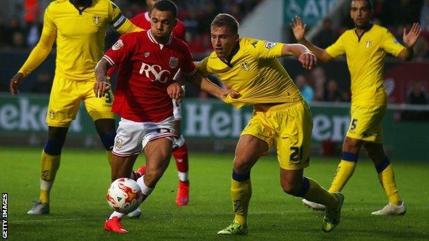 Ryan Fredericks of Bristol City battles with Charlie Taylor of Leeds United