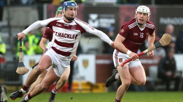 Cushendall's Ed McQuillan attempts to burst away from Slaughtneil's Meehaul McGrath at Pairc Esler
