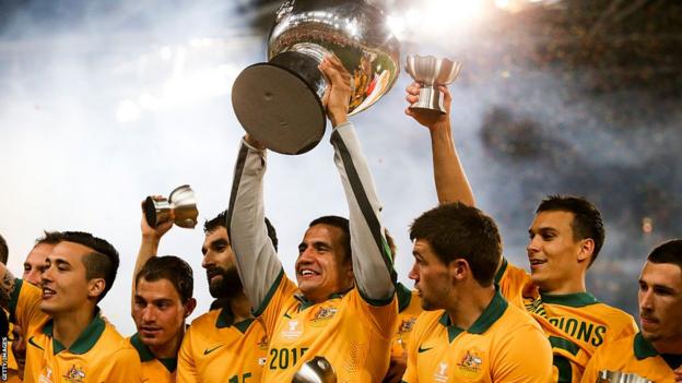 Tim Cahill holds the Asian Cup aloft after Australia's win in 2015