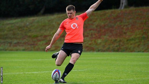 Owen Farrell kicks the ball